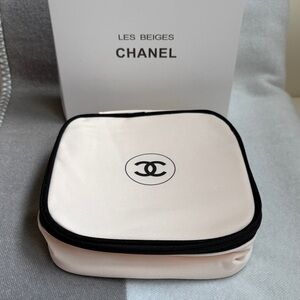 CHANEL Beige Cosmetic Case with Black Trim comes in a box as seen in the photo